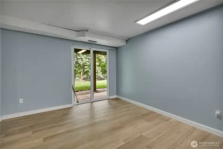 One of the extra rooms with a slider that leads outside. One of the extra rooms with a slider that leads outside.