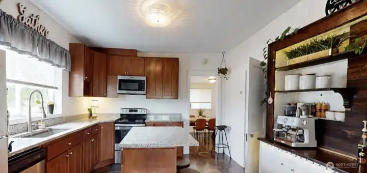 Kitchen with cherry cabinets, and almost new stainless appliances.
