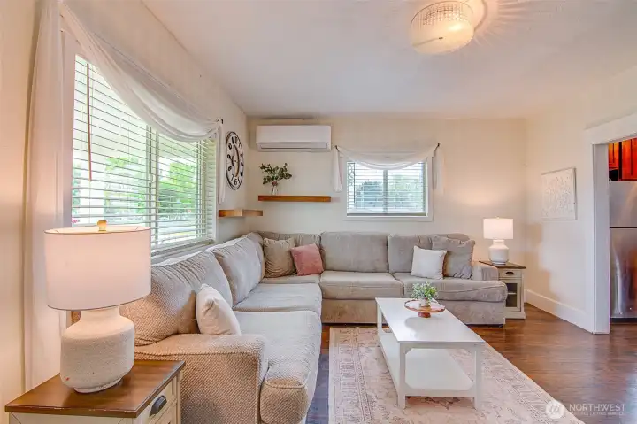 LThe living room is enhanced with a new mini split system, providing efficient heating and air conditioning for year round comfort.