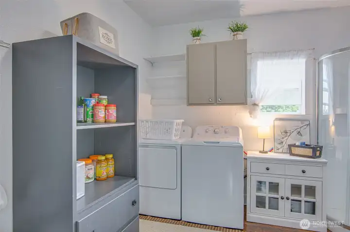 The large laundry room provides valuable everyday function, offering extra space for storage, laundry needs, and household organization.
