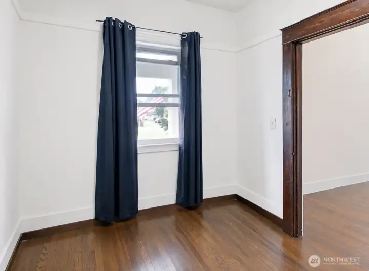 Main level bedroom or office with a window, conveniently located near the entry