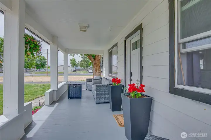 Enjoy a covered front porch with space for seating, perfect for morning coffee, evening wine, or simply relaxing at the end of the day.