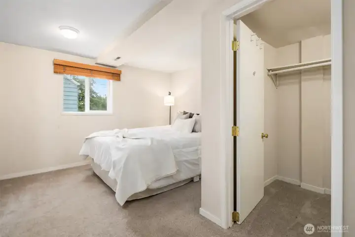 Lower level bedroom with egress window and closet