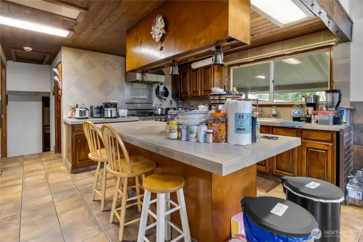 Large kitchen space with a large island for all your edible creations Large kitchen space with a large island for all your edible creations