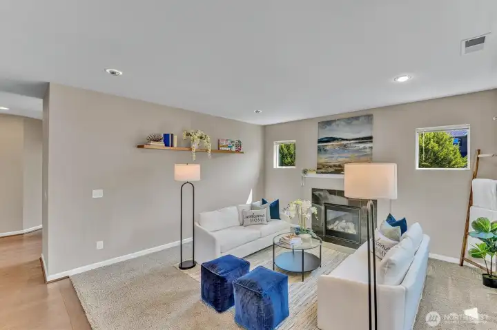 Spacious gathering space with gas fireplace. Spacious gathering space with gas fireplace.