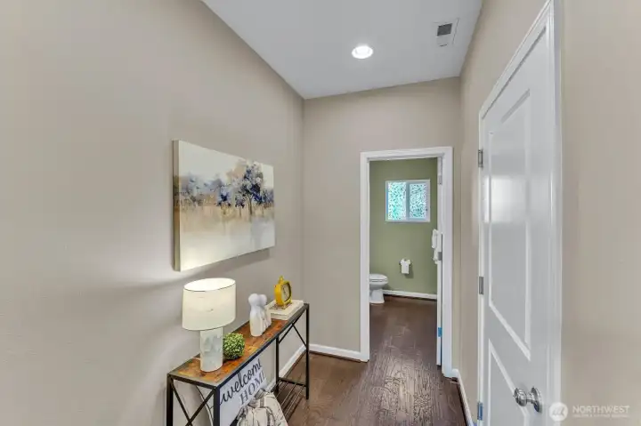 Separate hallway to main floor 1/2 bath Separate hallway to main floor 1/2 bath
