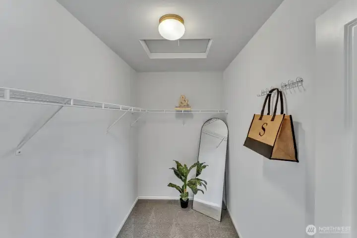 Primary walk in closet. Primary walk in closet.