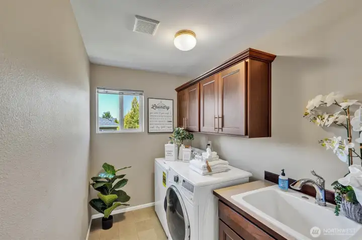 Laundry room with sink, cabinetry and a window is so nice!! Laundry room with sink, cabinetry and a window is so nice!!