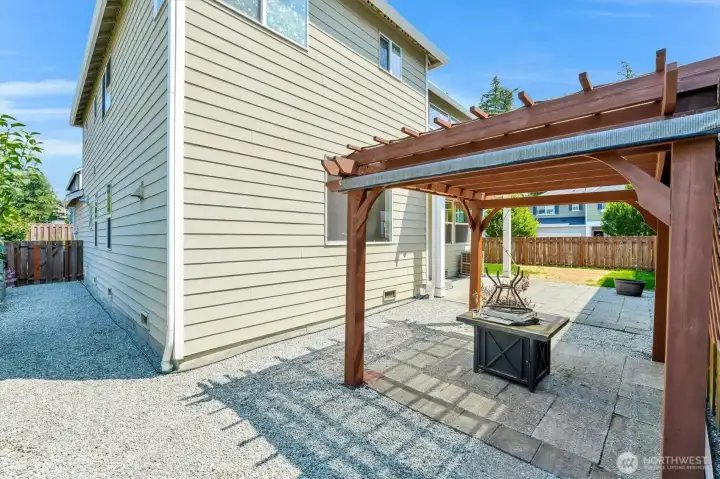 Back yard with gazebo and outdoor fireplace that stays. Back yard with gazebo and outdoor fireplace that stays.