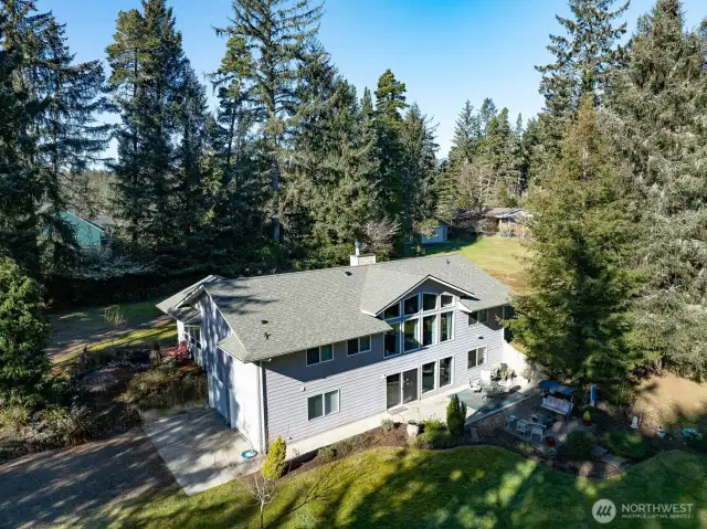BEAUTY, PRIVACY AND ACREAGE. This 3 bedroom, 2 1/2 bath custom built home sits on a little over 2 acres.