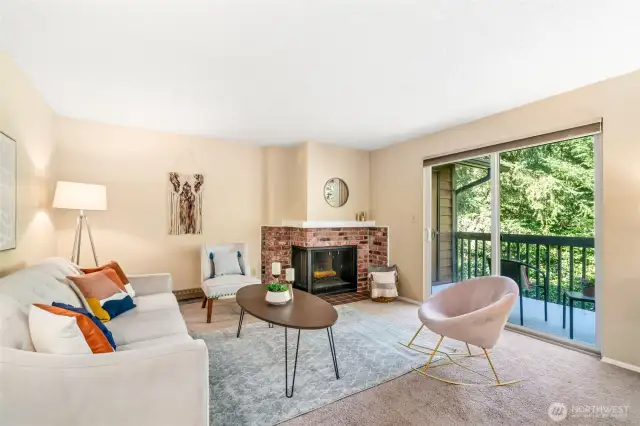 Living room with fireplace and deck access