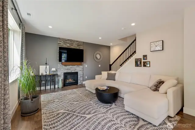 Relaxing living room with the fireplace and overlooking the back garden and sunsets.