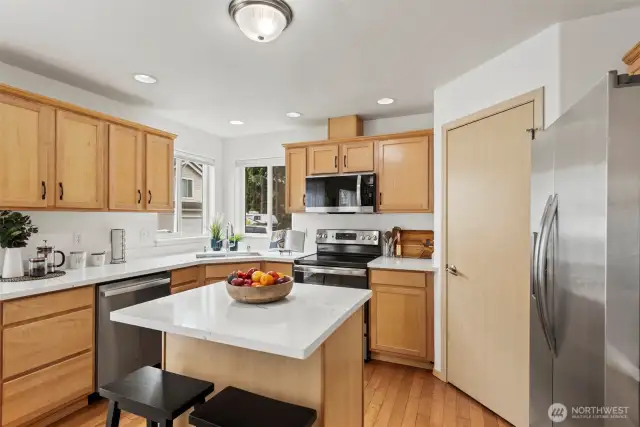 Kitchen with new counter, large sink, and new fridge