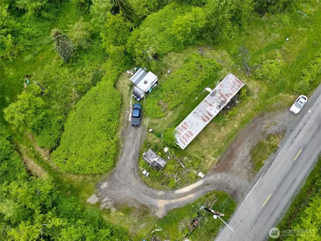Existing single wide is a tear down. Tenant on site in camp trailer behind.