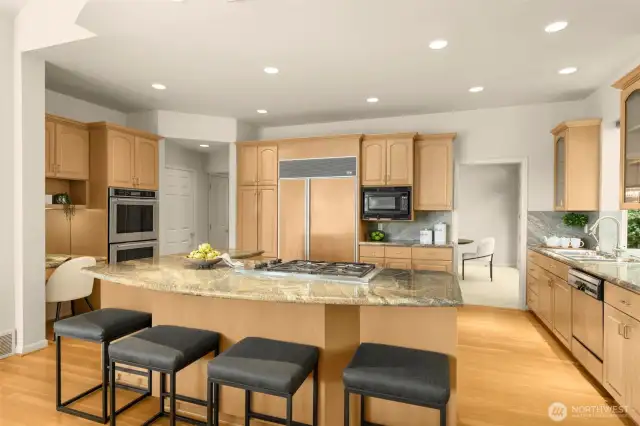 Large central island, sub zero fridge/freezer and double wall oven making carefree meals and entertaining