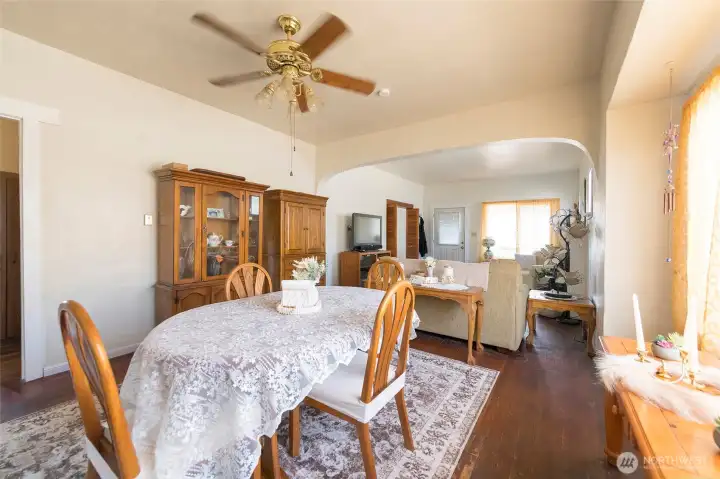 Dining area flows seamlessly from the living space, offering a versatile spot for gatherings.