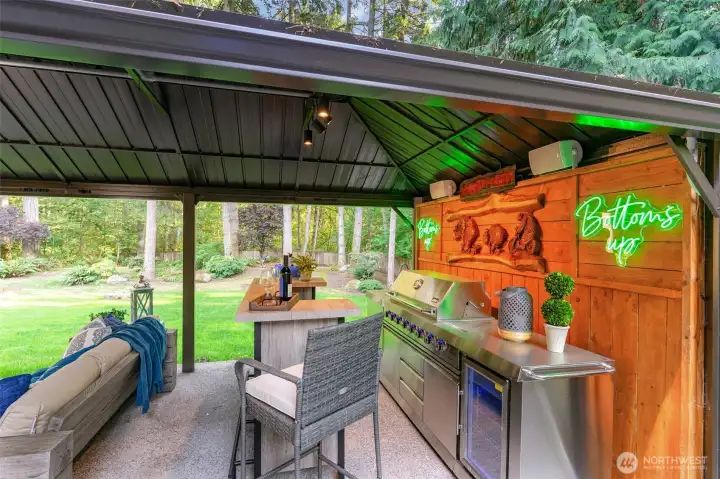 New kitchen gazebo with a built-in BBQ, wine fridge, bar and sound system.