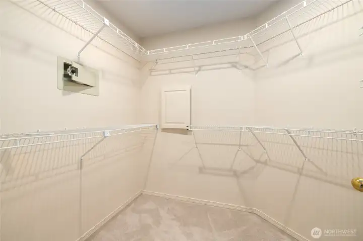Primary Bedroom Walk in Closet with Laundry Shoot