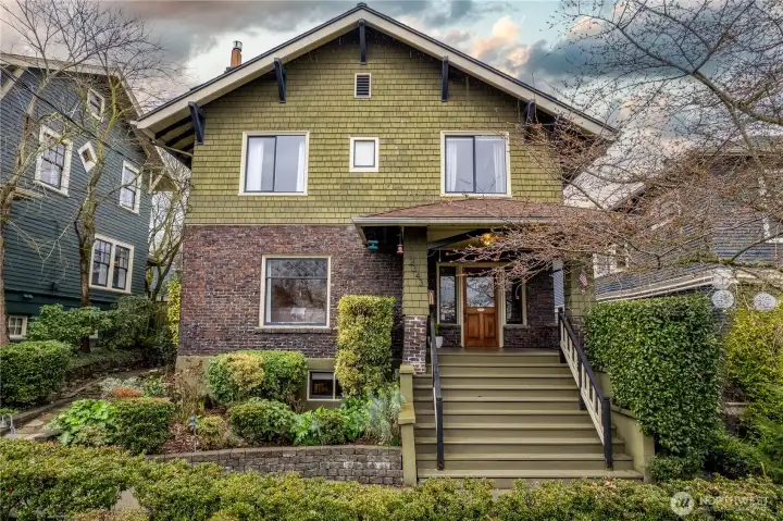 This quintessential Craftsman was built in 1906 and is perched up off the street allowing for commanding views.