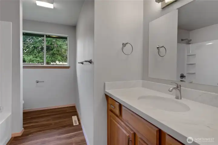 Main bath. New bath, surround toilet, counters and faucets