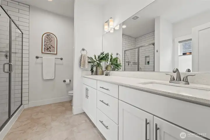 Double vanity, separate tiled shower and garden tub