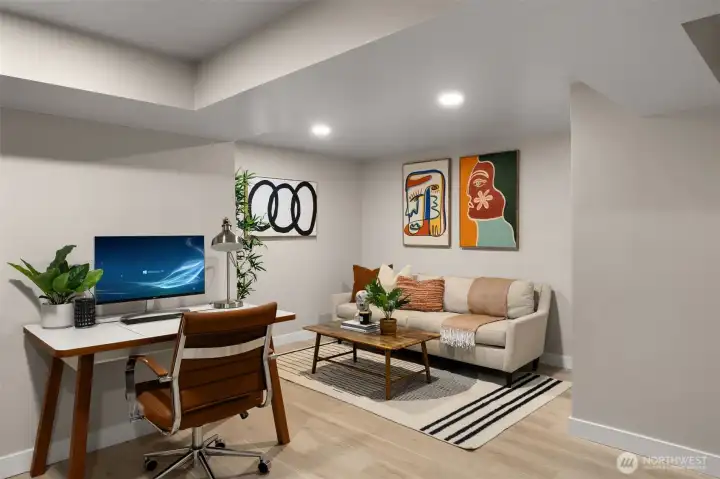 The newly finished lower level with a stackable W/D & versatile space perfect for an office &/or media room or whatever suits you.