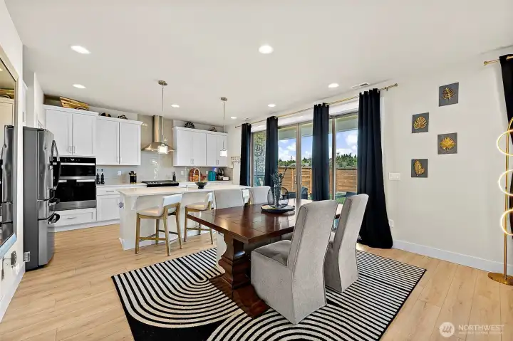 Large slider to covered parch from kitchen is handy for seamless indoor/outdoor entertaining.