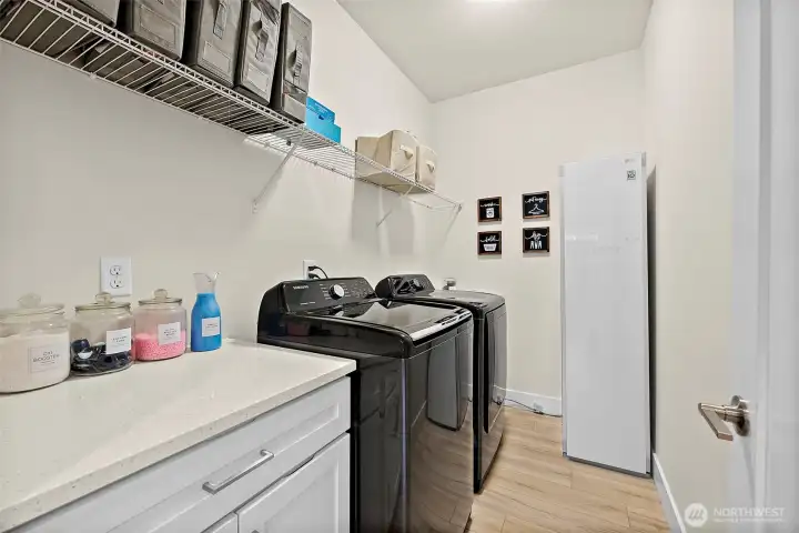 Upstairs laundry is conveniently located where your laundry is! Folding counter and cabinet for storage.