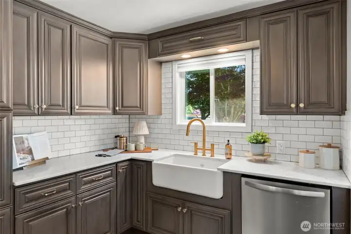 Gaze out and enjoy your beautifully manicured backyard oasis just from the kitchen.