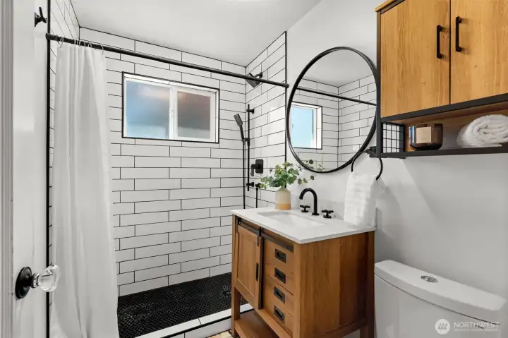 Fresh and functional! Clean lines and contemporary touches make this highly efficient shared bathroom both beautiful and practical.