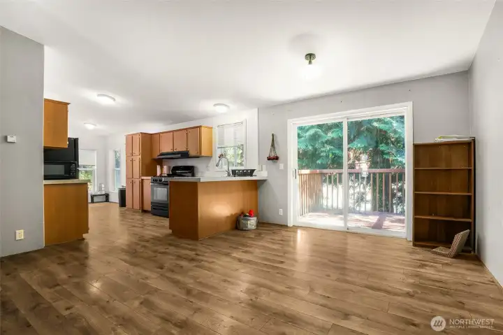 Living room leads to dining room, with access to kitchen and back yard.