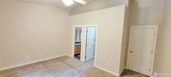 Primary suite with walk in closet and private bathroom