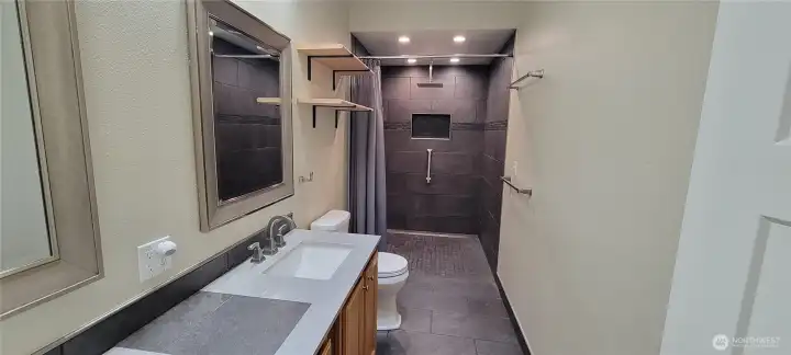 Primary suit bathroom with luxury rain shower!