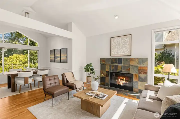 Gas fireplace in formal living room looking into formal dining