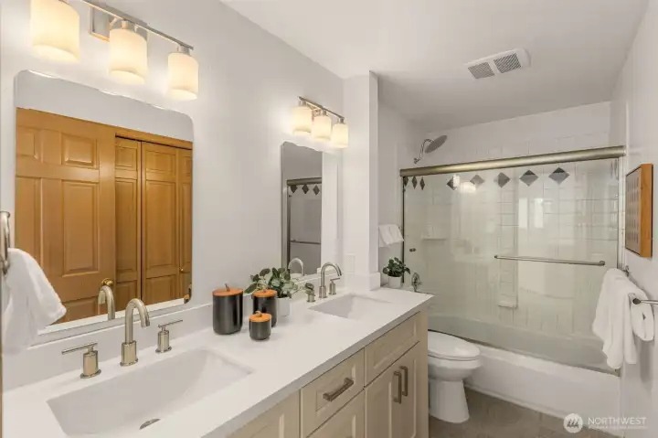 New quartz counters, sinks, cabinets, and floors in all bathrooms