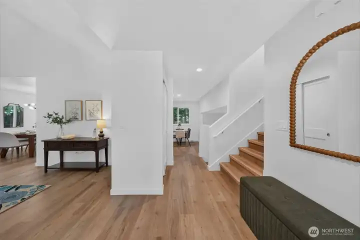 Step inside! To your left, the living room and formal dining room welcome you in. Straight ahead is the cozy eat-in kitchen nook, while upstairs you’ll find the primary suite and two additional bedrooms.