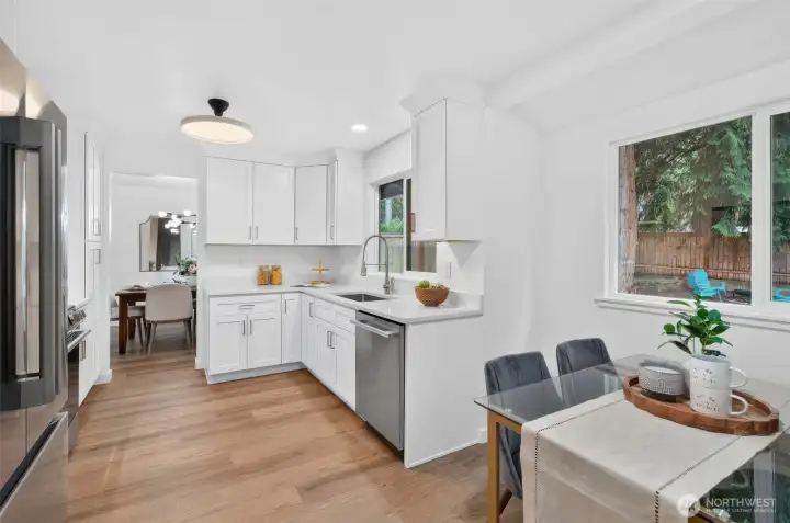 A fully renovated kitchen with brand-new LG stainless steel appliances, plenty of storage, and a sunny eat-in nook—ready for morning coffee, quick meals, and everything in between.