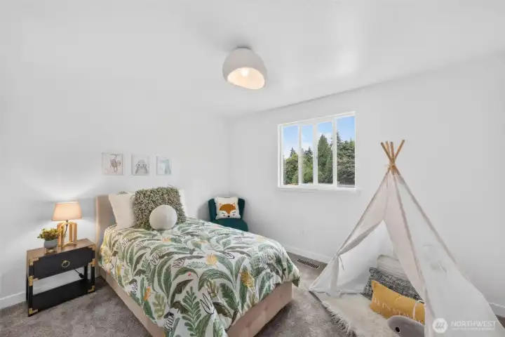 Bedroom one is bright, cheerful, and ready to become a cozy retreat, creative space, or the perfect room for someone special.