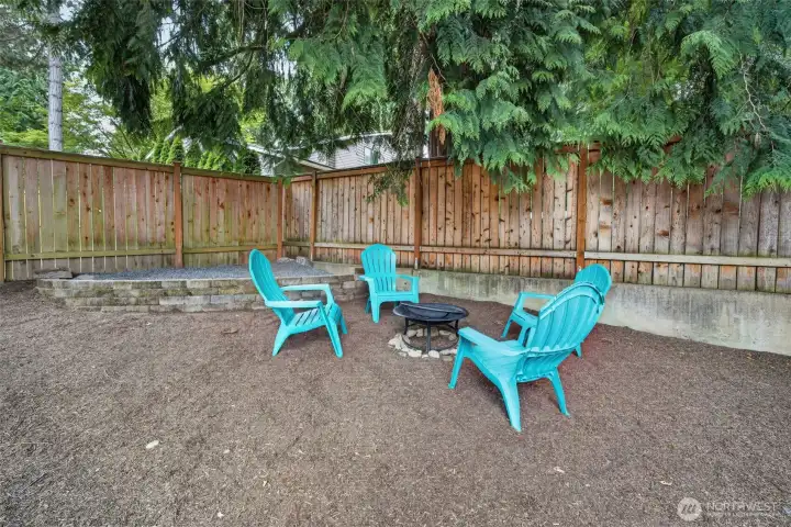 S’mores, hot dogs, stories, and maybe a little singing around the fire—this cozy backyard corner is ready for memories to be made.