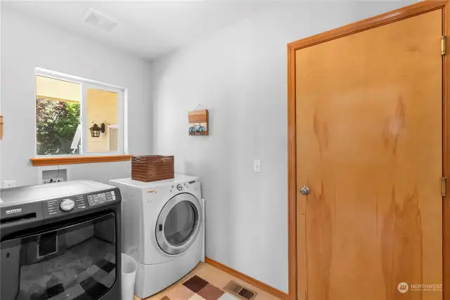 The laundry room is just off the kitchen and takes you to the garage!