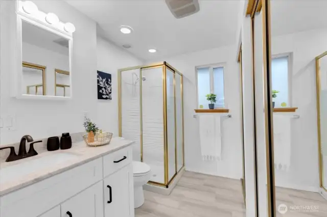 Double closets and updated vanity in primary bath