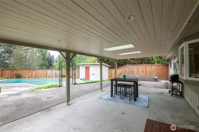 Large covered patio with skylights and overhead lighting