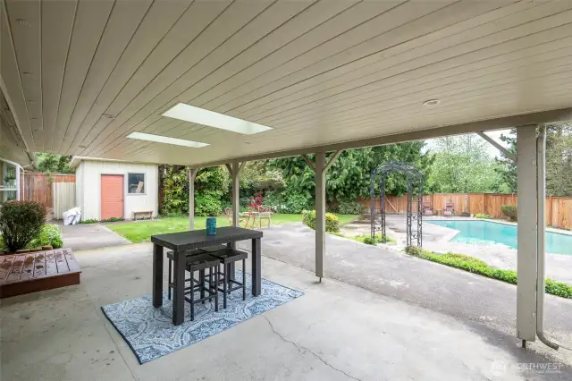 Large covered patio with skylights and overhead lighting