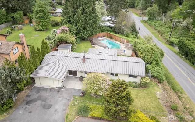Large corner lot. Property goes beyond fence line in back