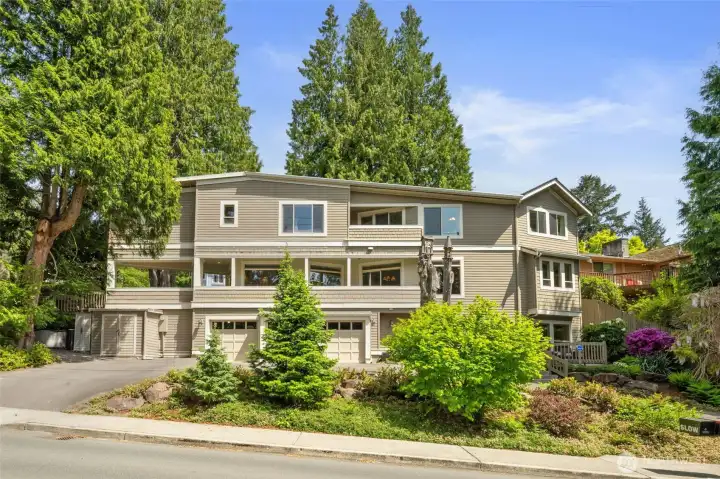 3 car garage w/ circular drive on back of home