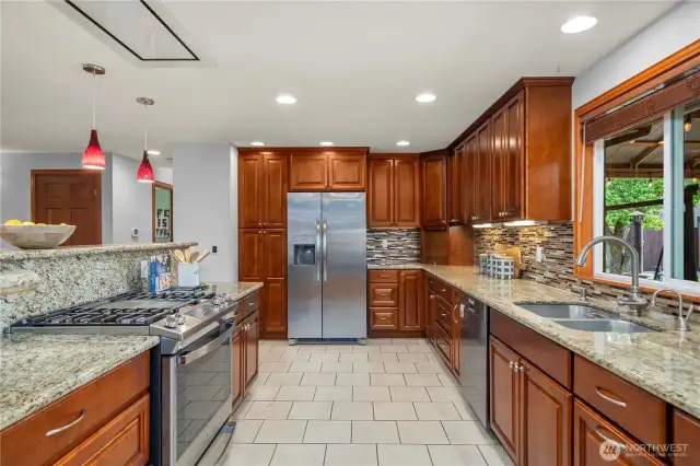 Gorgeous cabinets, heated tile floors, SS appliances, granite countertops, gas range, under-mount lighting & instant hot water