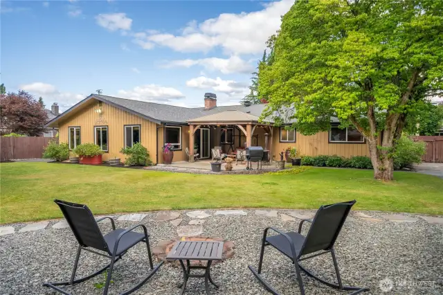 Fire-pit area over looks the expansive backyard