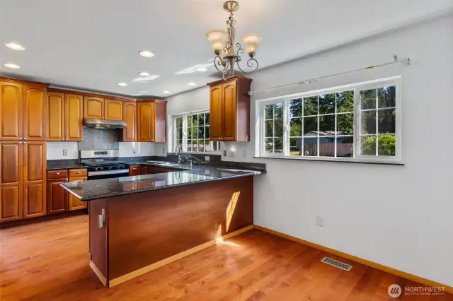 An abundance of cabinets and granite counters