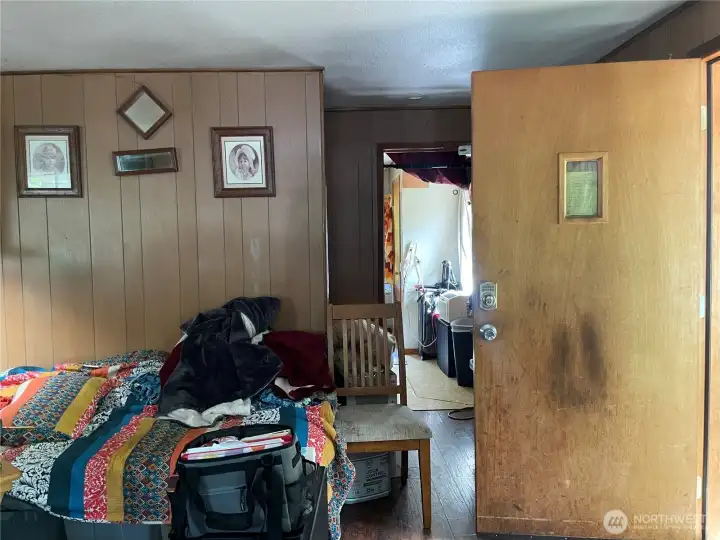 When you head inside you'll begin with the living room. Stairs and door to master bedroom would be to the right.