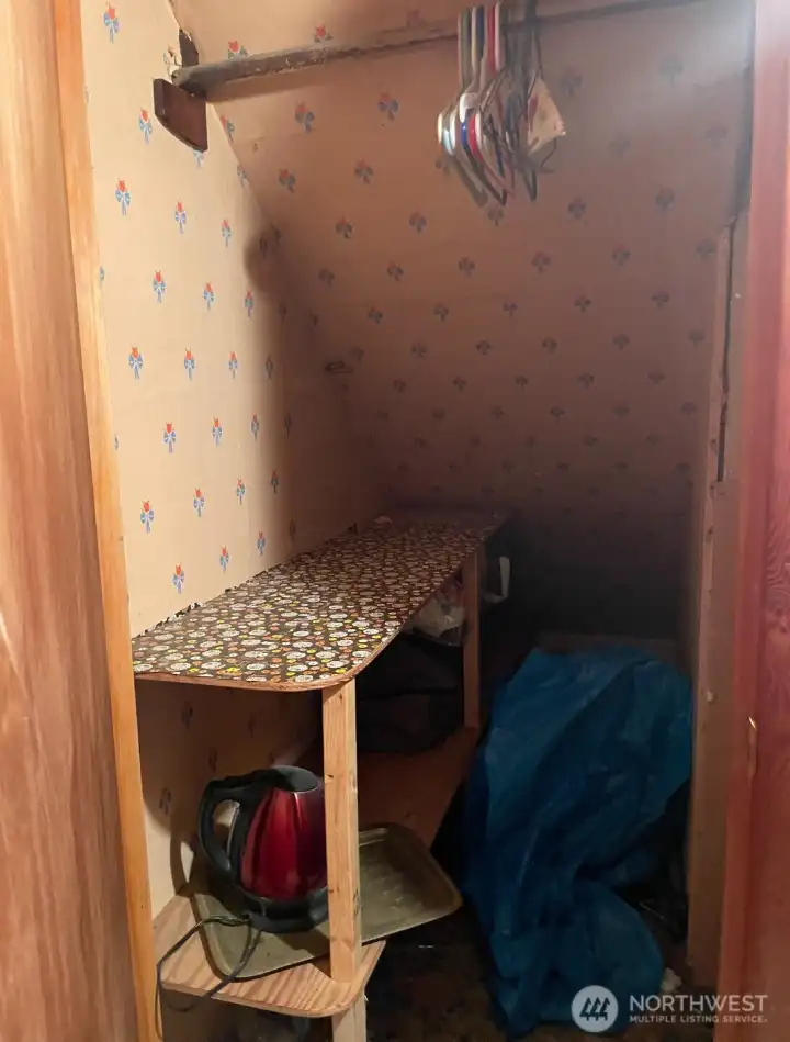 A closet in the master bedroom